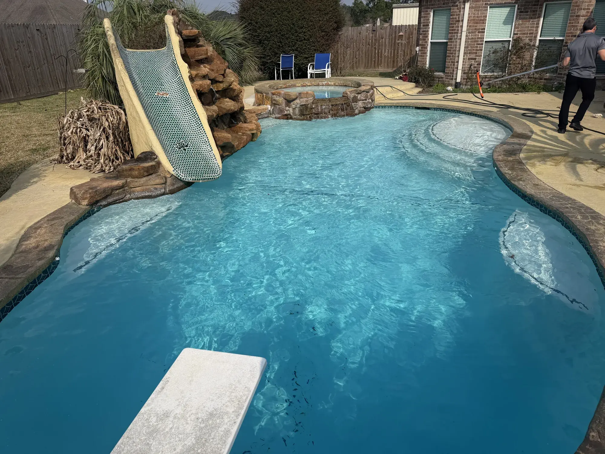 Completed backyard pool build with integrated landscaping in Houston County, TX