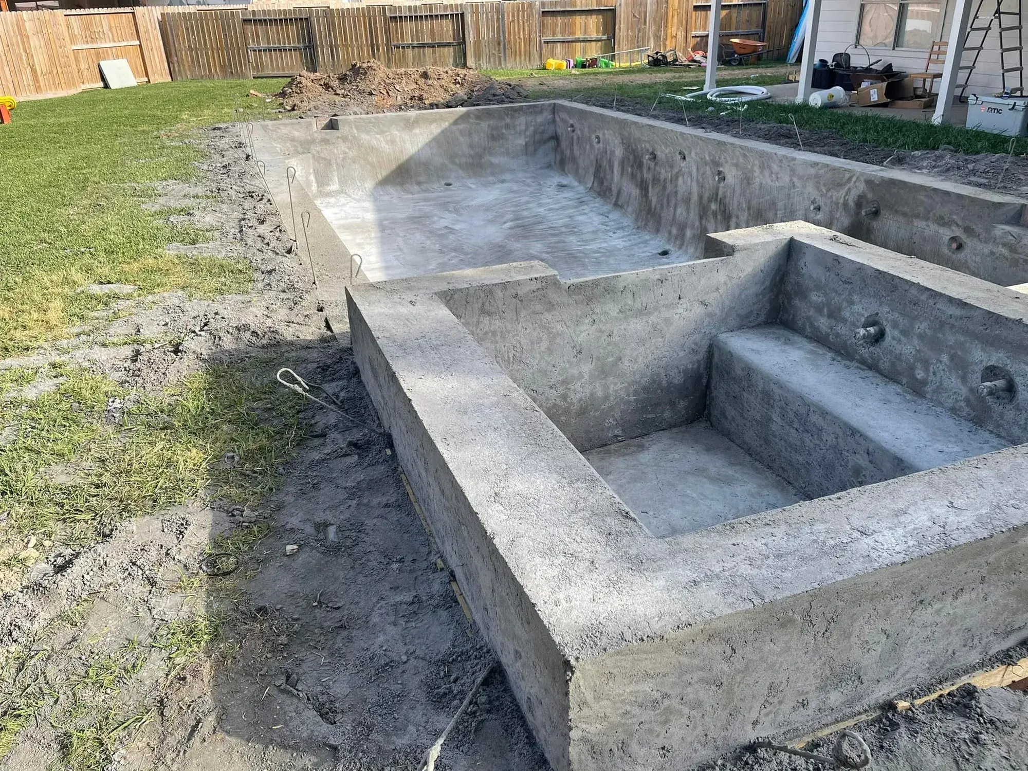 Gunite shotcrete pool shell after structural application during a new pool construction project in Houston County