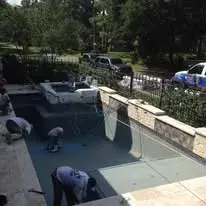 Plaster finish being installed in a freshly built swimming pool by Sam Houston Pools and Outdoors